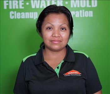 Woman in front of SERVPRO Logo 