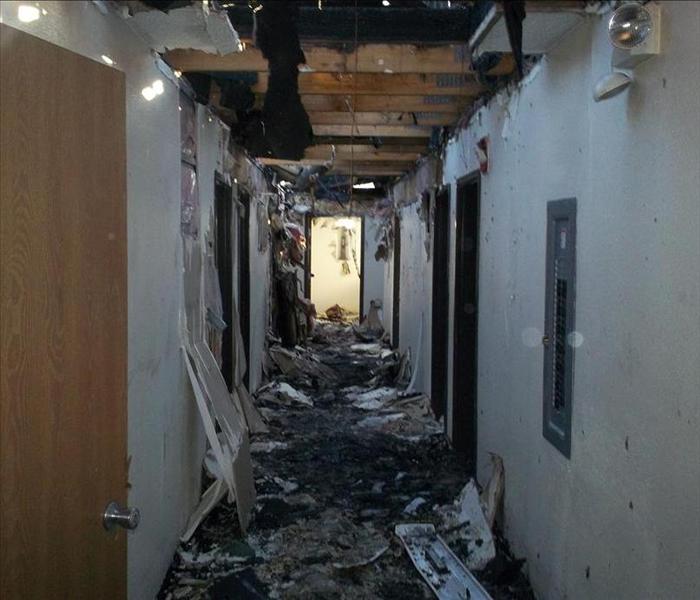 Fire damage to hallway in a motel.